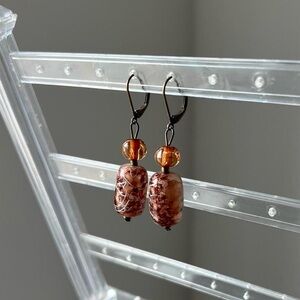 tortoiseshell glass dangly earrings with silver chrome design